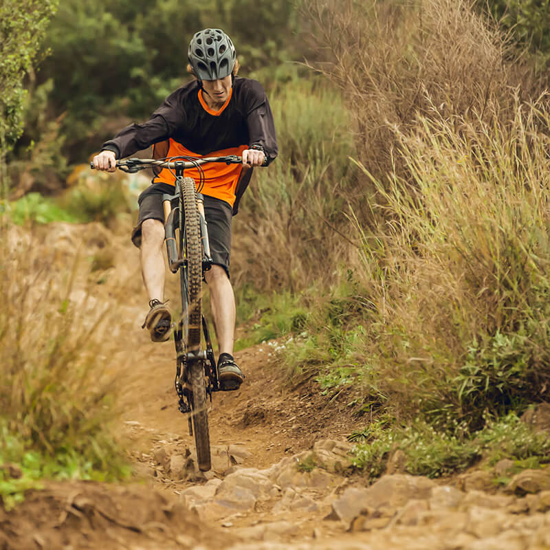 A mountain biker on a steep trail.