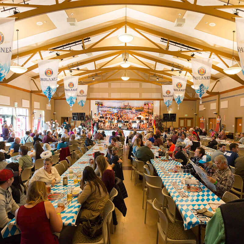 A packed beer hall at a festival.