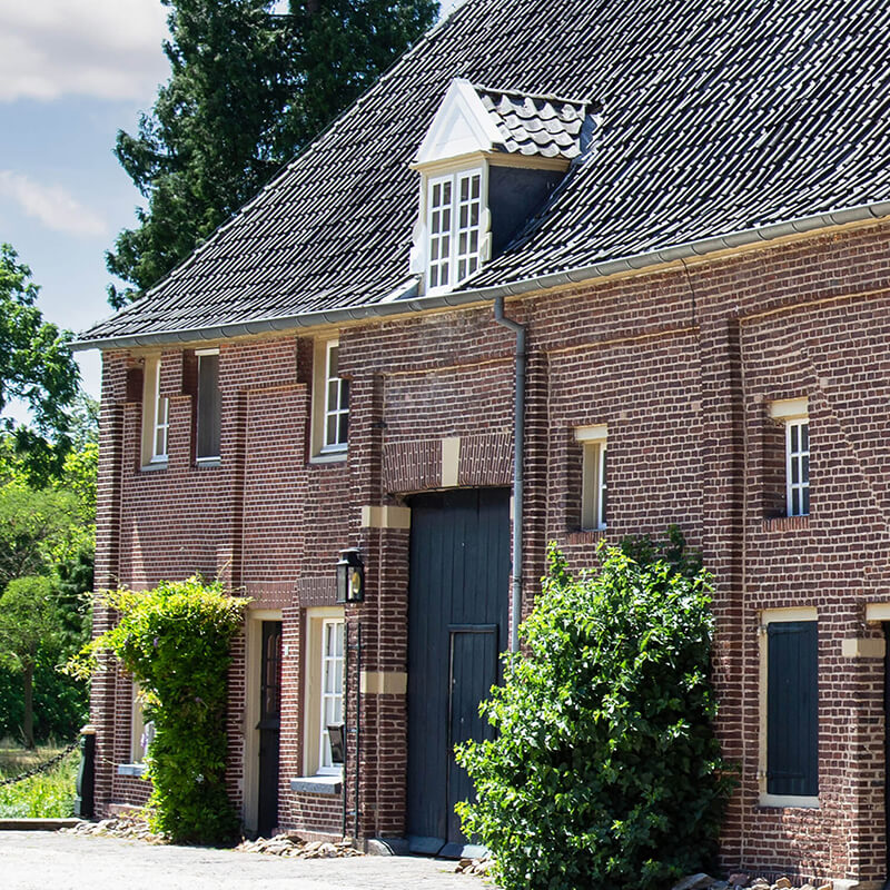 The outside of an old brick fort building.
