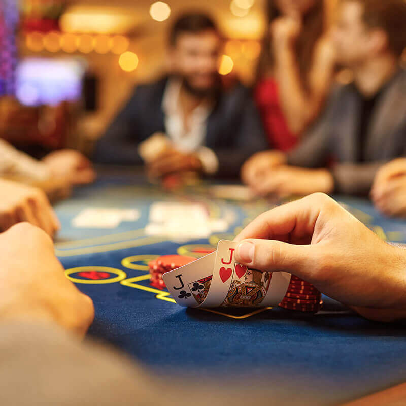 A card game at a casino table.
