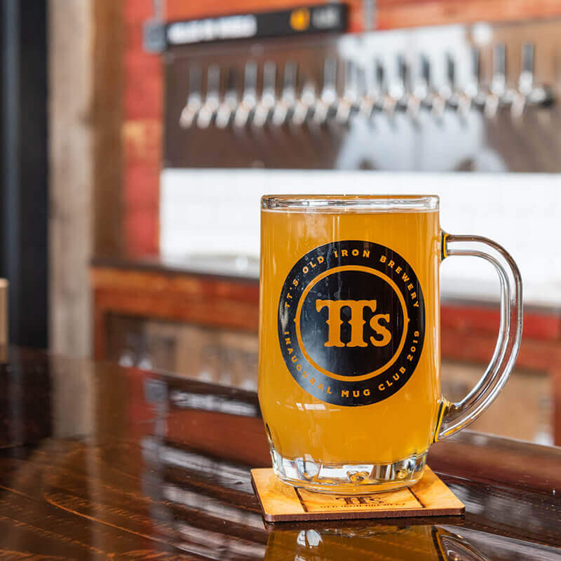 A beer mug sitting on a table.